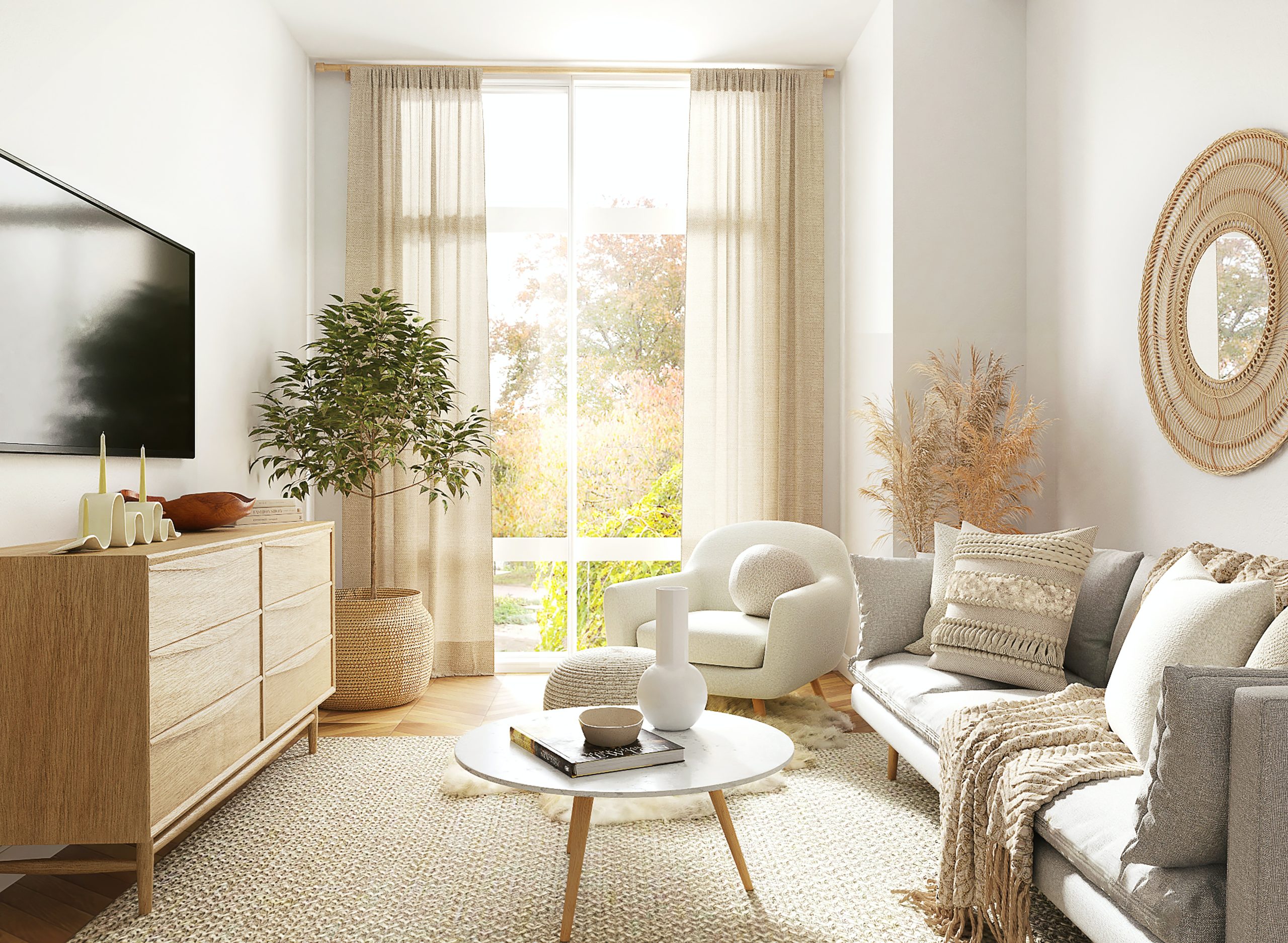 Sala pequeña con decoración minimalista, sofá gris y silla blanca junto a la ventana